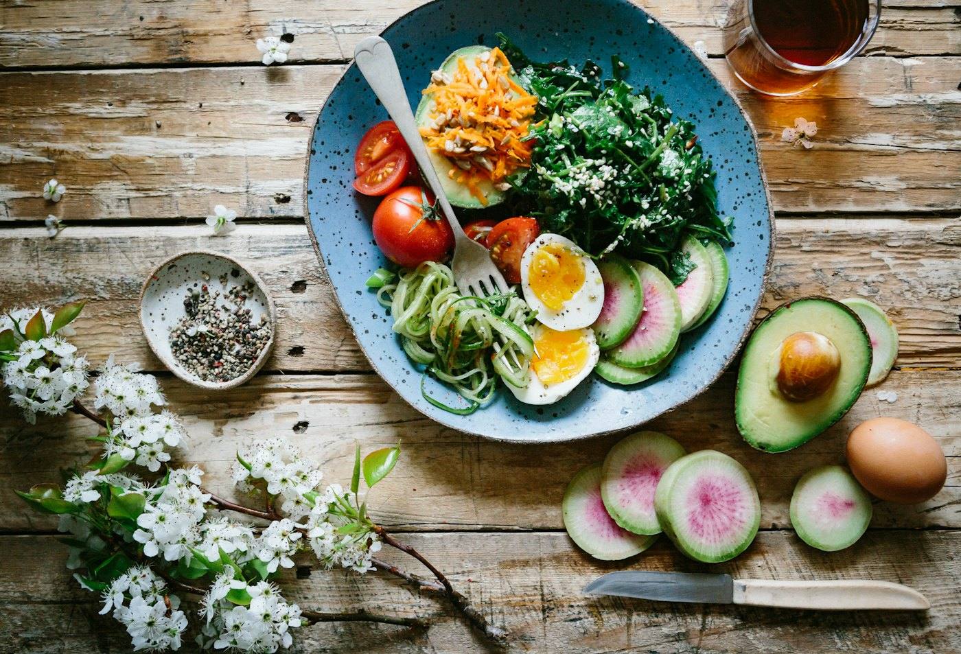 Healthy plate with eggs, greens and vegetables